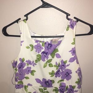 a white dress with a purple floral design.